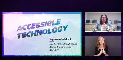 Shyamala Chalakudi speaking on accessible technology alongside a sign language interpreter.