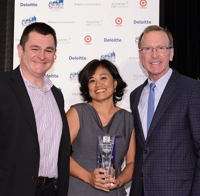 Rebecca Wang celebrates receiving the Civic 50 Award with Francisco Aragon of HPI (left) and Points of Light Chairman Neil Bush (right).